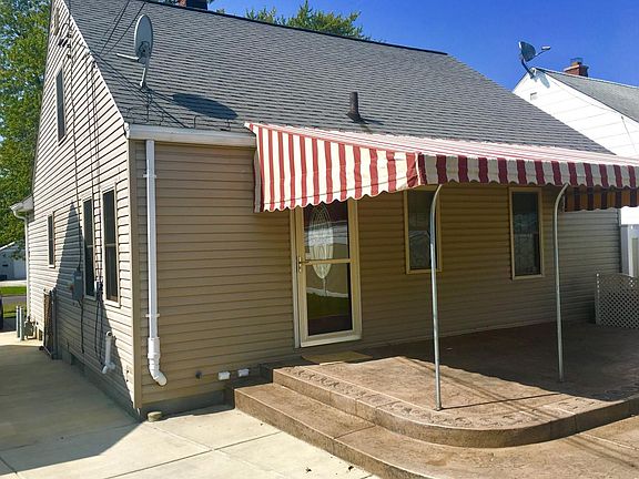 Rear of house with new stamped concrete patio