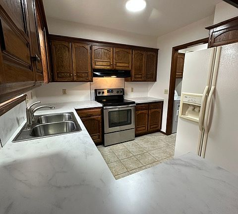 Includes refrigerator with filtered ice and water on the door