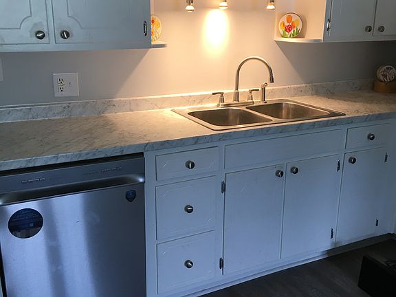 Kitchen sink and prep area with dishwasher
