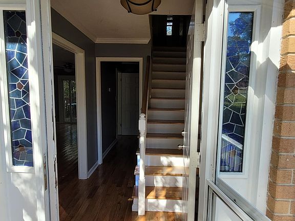 Right hand to kitchen, left hand to living room, stairs to second floor and straight to 0.5 bathroom.