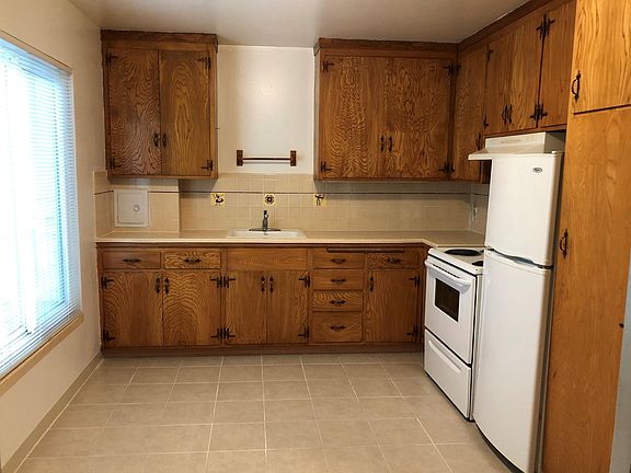 Kitchen with room for dining table (& a convenient garbage chute)
