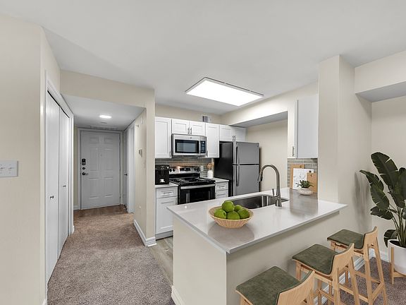 Deluxe Kitchen with Quartz Countertops and Stainless Steel Appliances