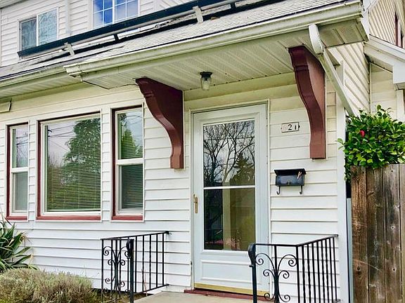 Front door and front porch; solar panels on roof