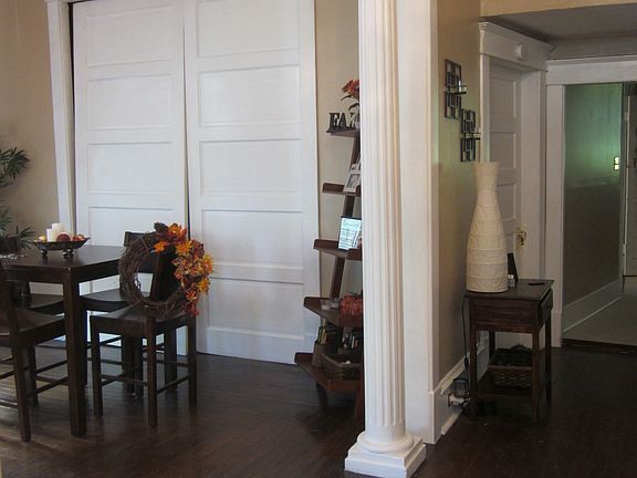 Dining area and hall leading to kitchen, check out the columns!