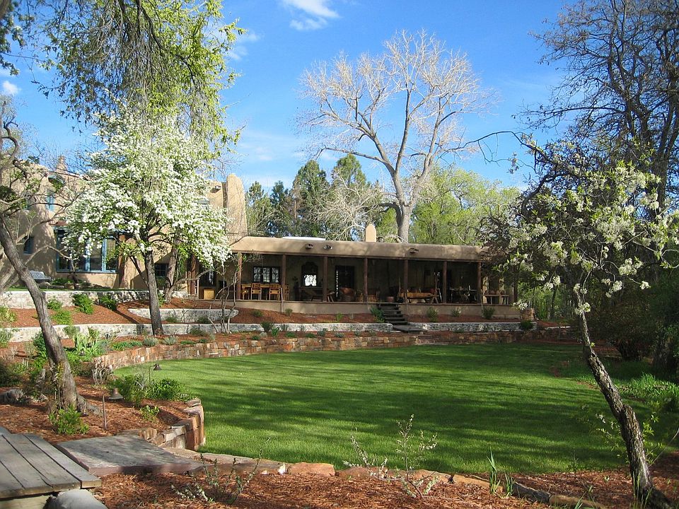 Off Bishopâ??s Lodge Road in the heart of Tesuque, this exquisite estate hidden behind security gate