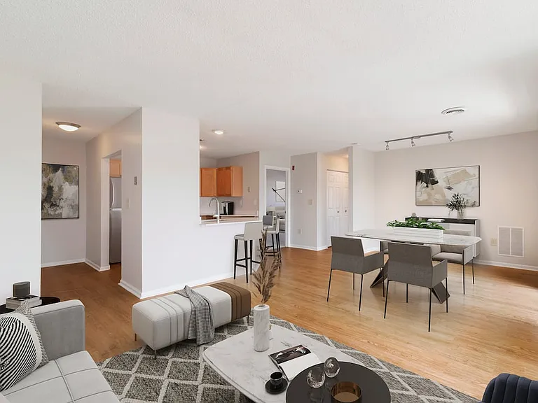 Renovated Package I living and dining room with hard surface flooring