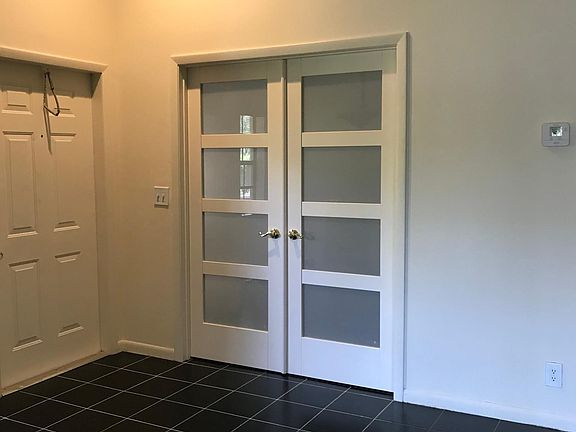 Interior Front Entry Door. French Doors accessing 3rd Bedroom/Den/Office.