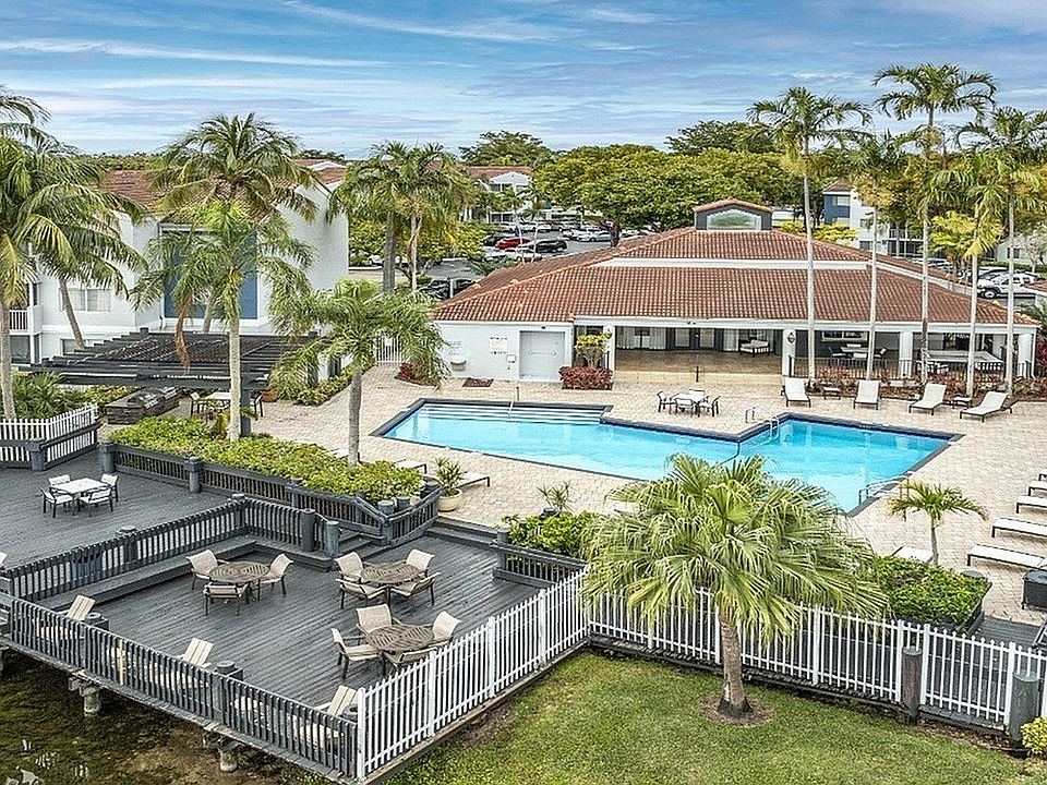 Building exterior with swimming poll and sitting area