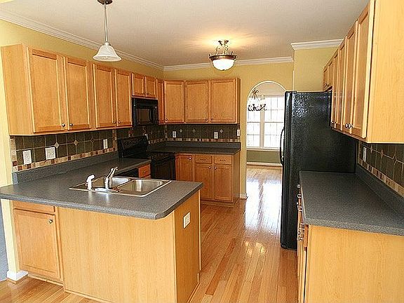 Lots of cabinet space with custom backsplash