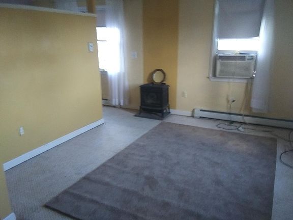 Living room, carpets will be cleaned and walls painted before move in.