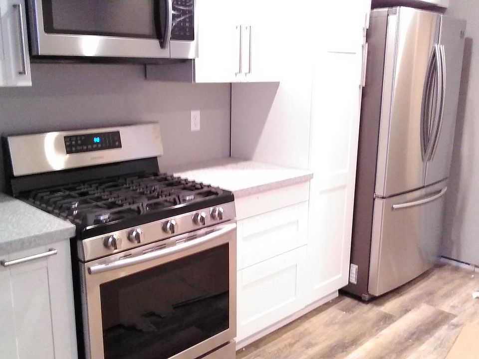 A totally new kitchen! Stainless appliances, granite counter tops, beautiful Shaker cabinetry and warm wooden floors