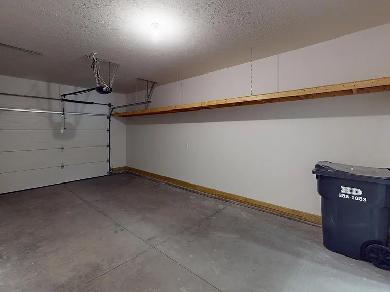 Single car oversized garage with Overhead storage