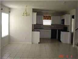 VIEW OF KITCHEN AND BREAKFAST AREA