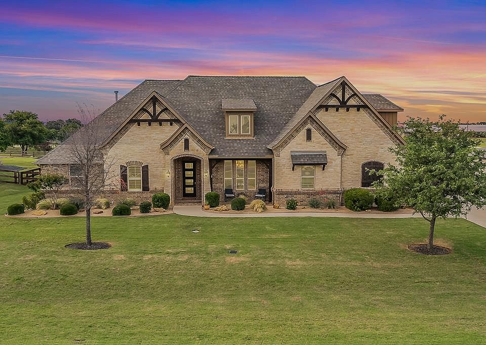 View of front of home with a lawn