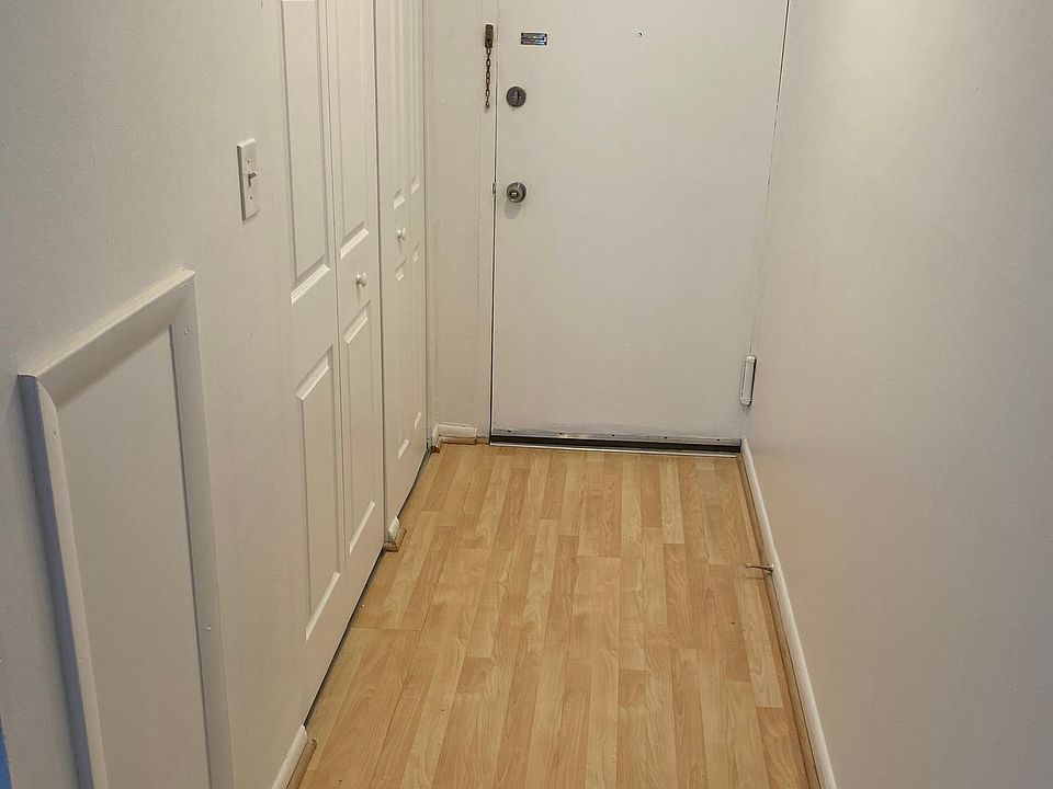 Entryway with 2 closets for coats and storage