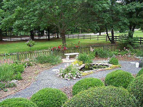 View of perennial garden and pond