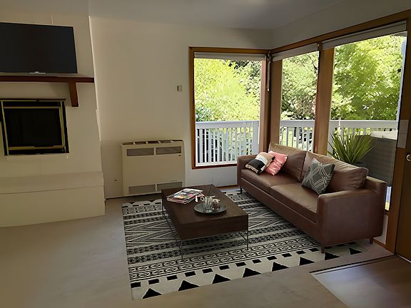 Large windows looking out to private deck