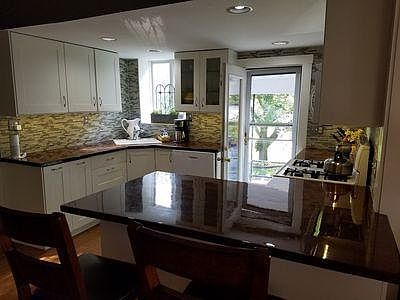 Kitchen and back door to driveway and good sized back yard.