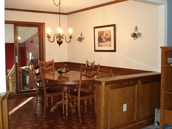 Open floor plan dining room opens to living room, kitchen, 