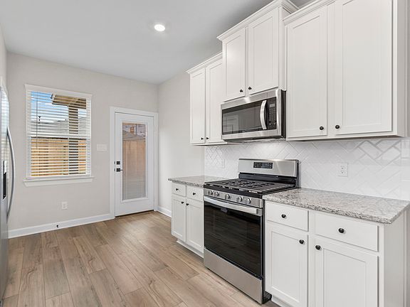 The kitchen comes with a full suite of energy-efficient appliances.