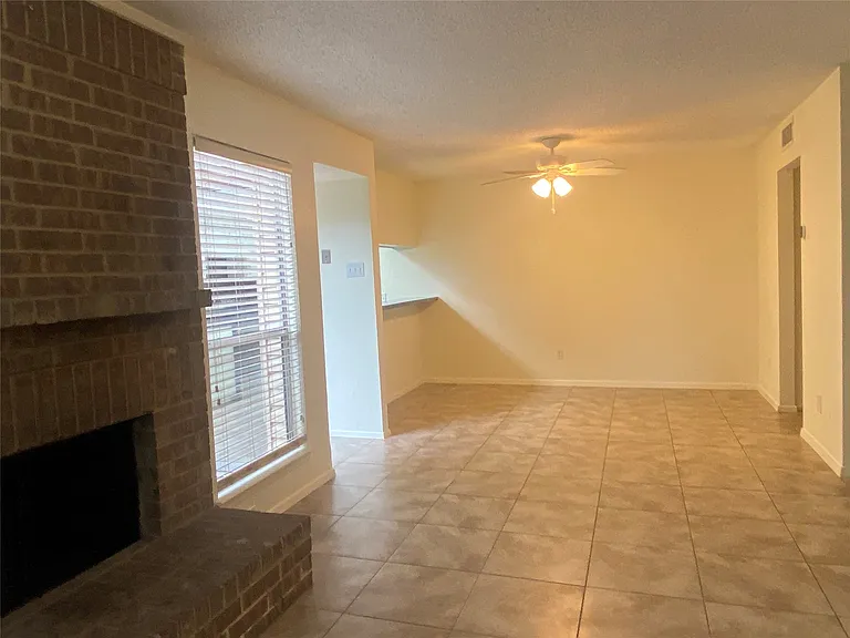Tile flooring in living, kitchen and dining.