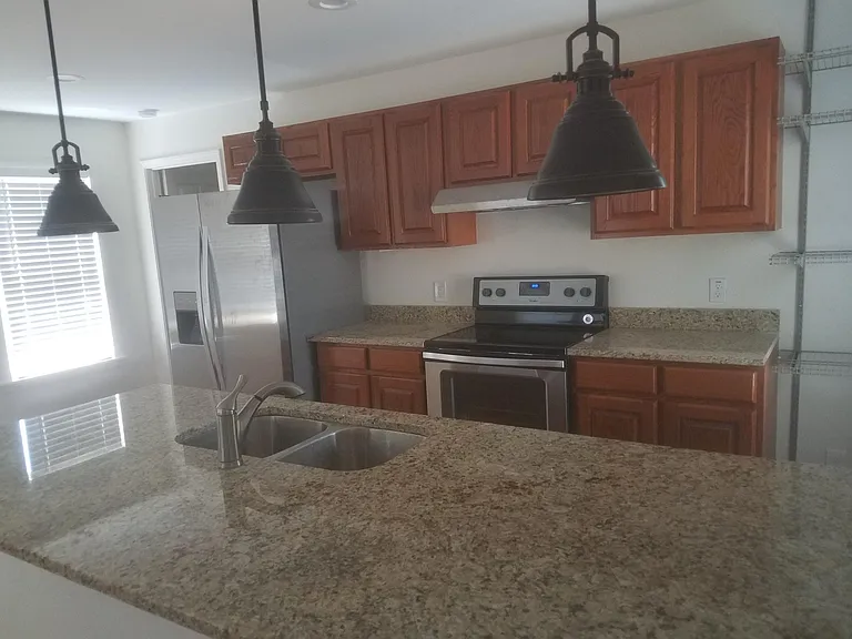 Kitchen with granite counters and center isle.