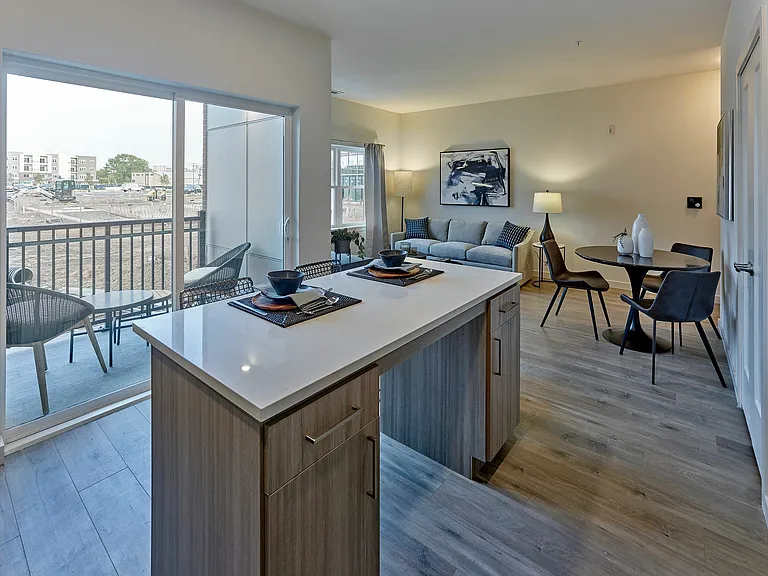 Experience modern elegance in this open-concept living area featuring stylish decor and ample natural light.