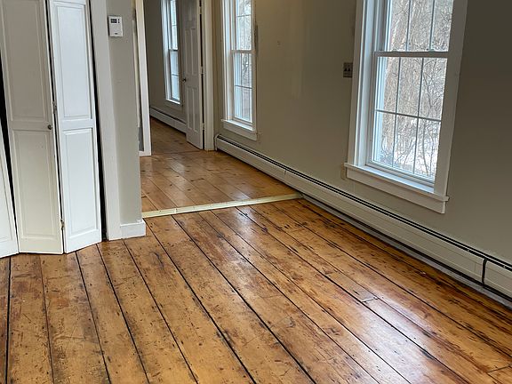 living room and hallway outside of bathroom
