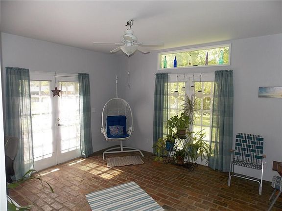 Wonderful sun room with French door access to open patio.  Great place to relax.