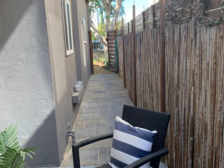 Patio to front yard (gate to common area)
