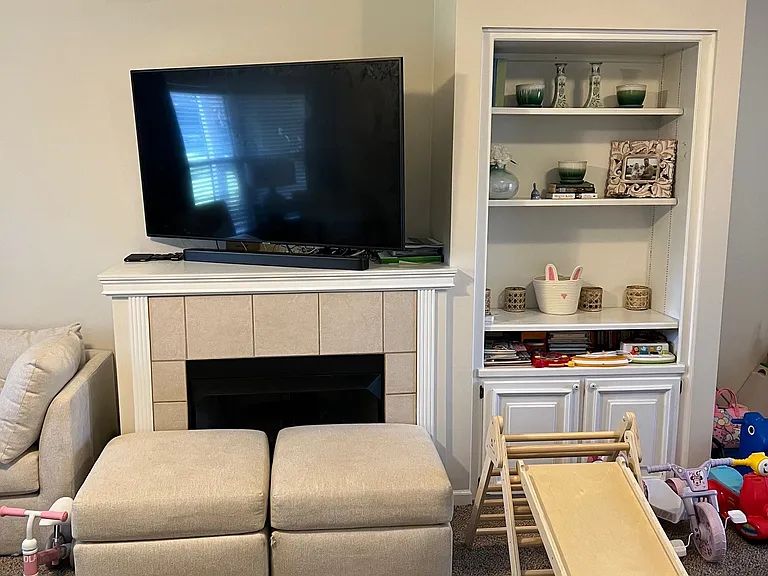Living room tv area plus built ins. Gas fire place is perfect for the colder months.