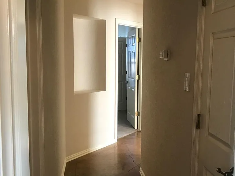 Hallway to 3 bedrooms split from Master. Left hall bath and right linen closet
Decorative nook in wall