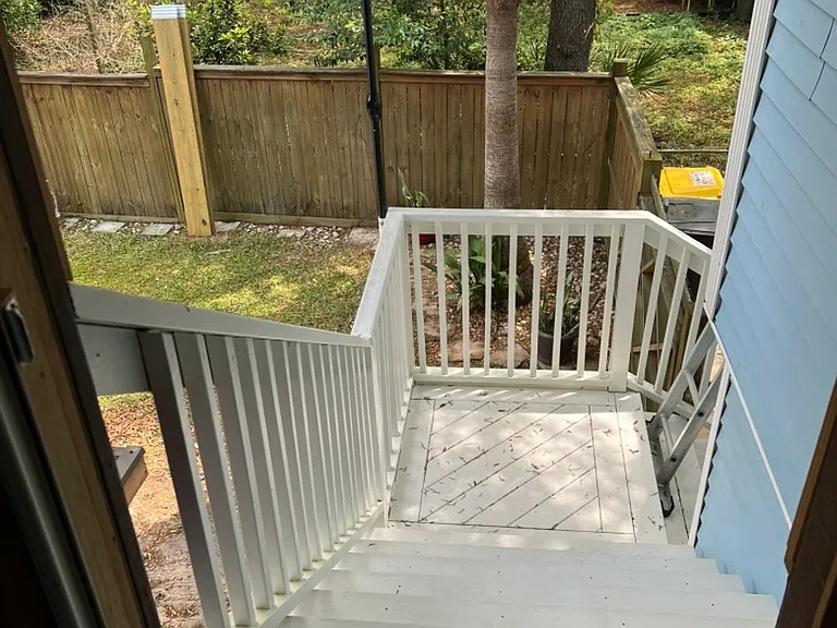 Stairs to and from apartment entry to carport parking (room for one vehicle long term). Temporary guest parking welcome.