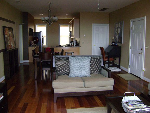 Living room open to dining room and kitchen.