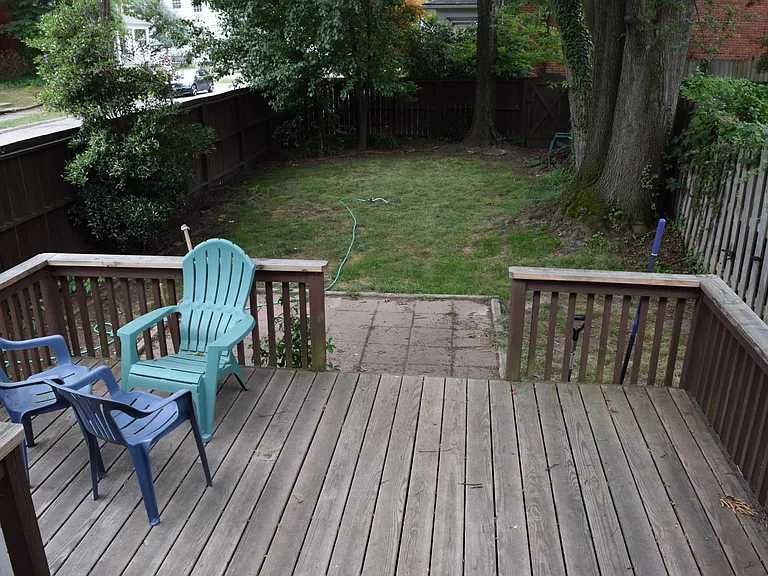 Deck, patio and yard with mature trees providing ample shade in the summer.