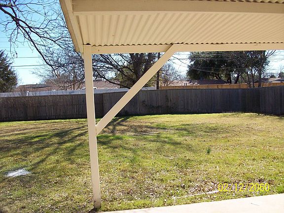 Back yard from under patio cover
