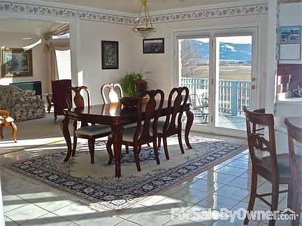 Dining room is open and bright. : Has excellent views, and opens out to the deck. Door has retractib