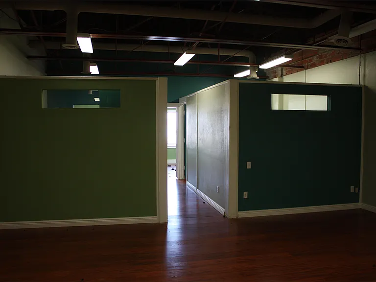 Large open area between reception area and 3 back offices.