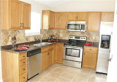 This is a similar home * Finishes will be the same Stainless Appliances * Ceramic Tile Floors * Backsplash is not in the home at 642 Branch Ct.