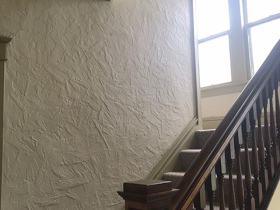 Steps leading to upstairs apartment from front entrance.