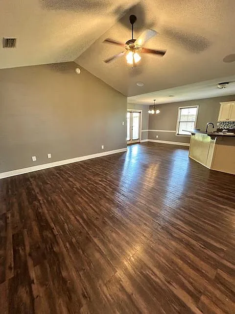 Entry way leads into the living room with vaulted ceilings and an open kitchen concept - 1362 Majesty Loop
