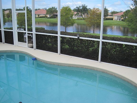 custom pool with water view in back 