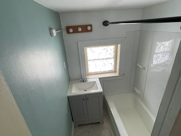 Remodeled bathroom, tub and shower combo.