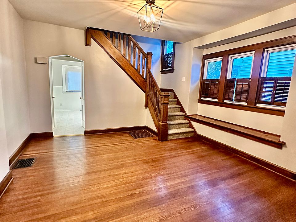 gorgeous dining room with large family room towards the front of the house and ktichen in the back.