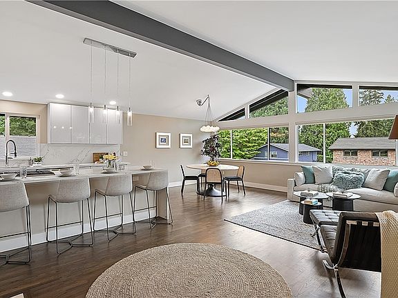 Great room concept floor plan with kitchen, living room, and eating space all open to each other~ perfect for connecting and intermingling!