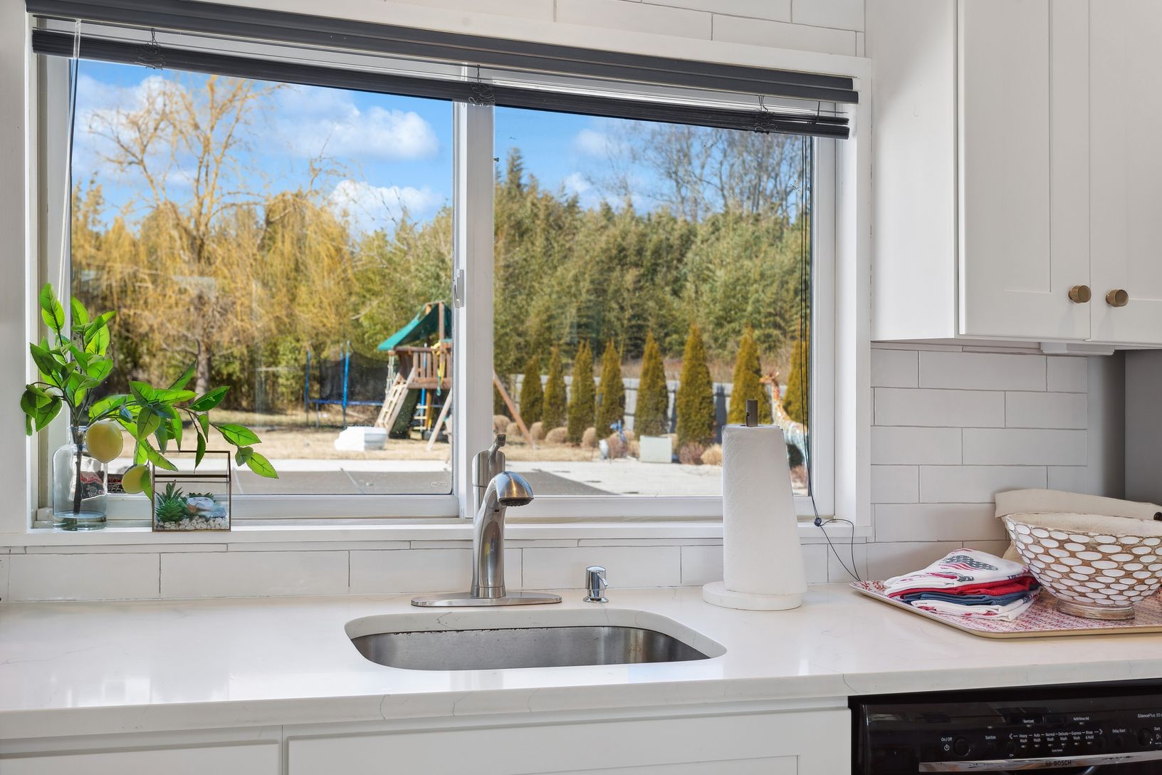  view of expansive yard, patio & pool from kitchen