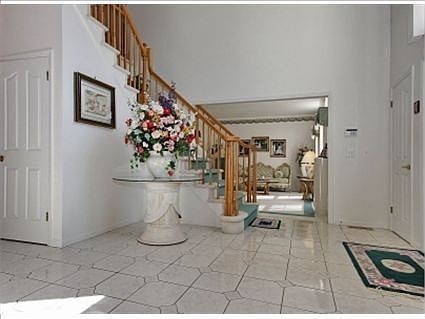 Gracious two-story foyer with dramatic staircase