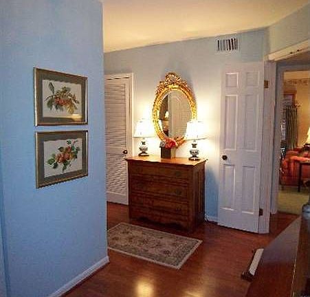 Condo Foyer with appealing Cherry Wood Laminate Flooring!