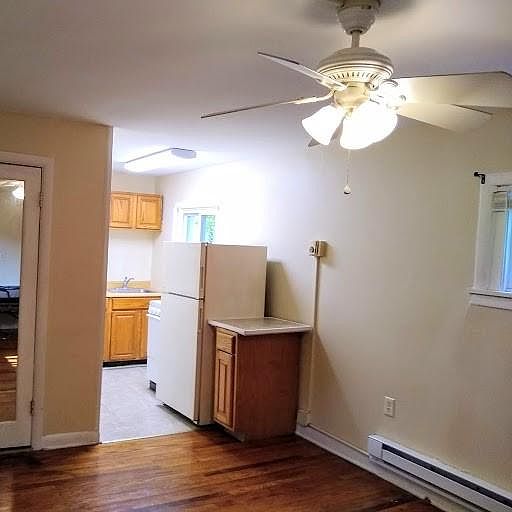 Closet/ full length mirror, ceiling fan, Kitchen cabinets, stove, refrigerator