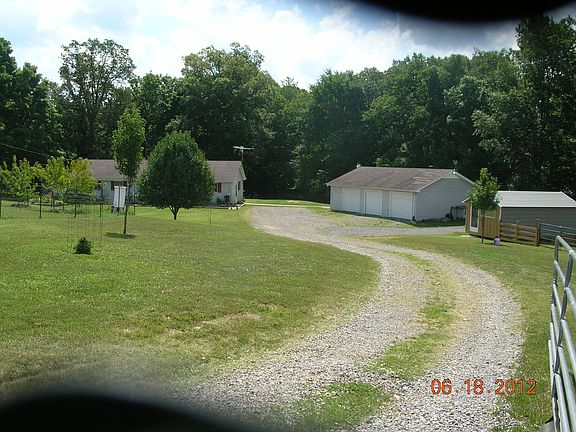 at the gate midway up the drive
